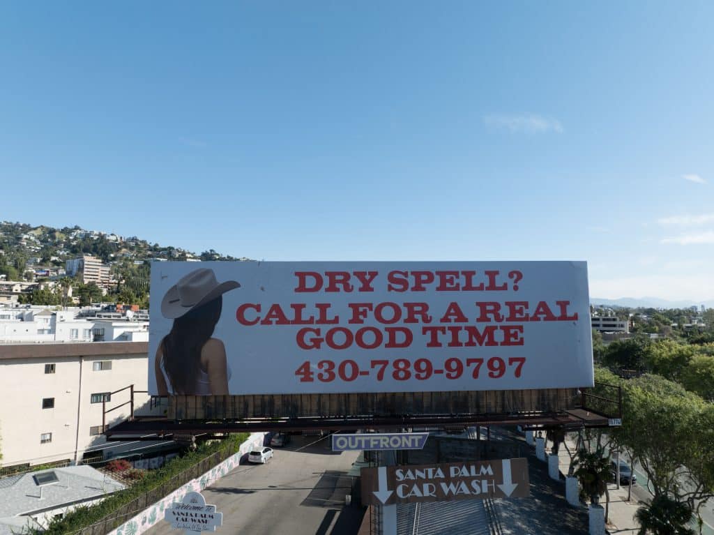 Bulletin billboard on the Sunset Strip in Los Angeles advertising a real estate campaign
