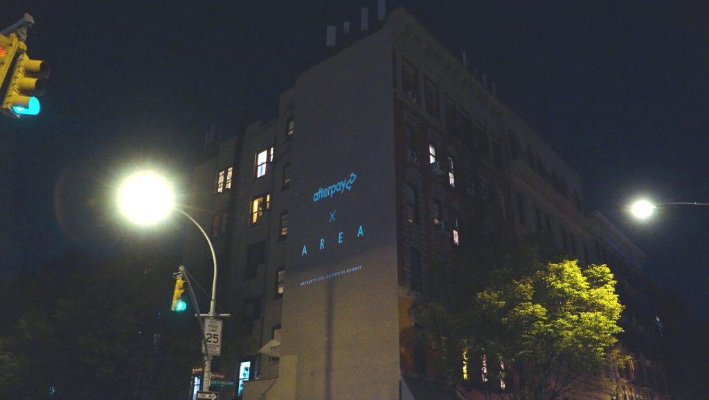 New York Fashion Week wall projection advertising campaign on a building facade in New York City