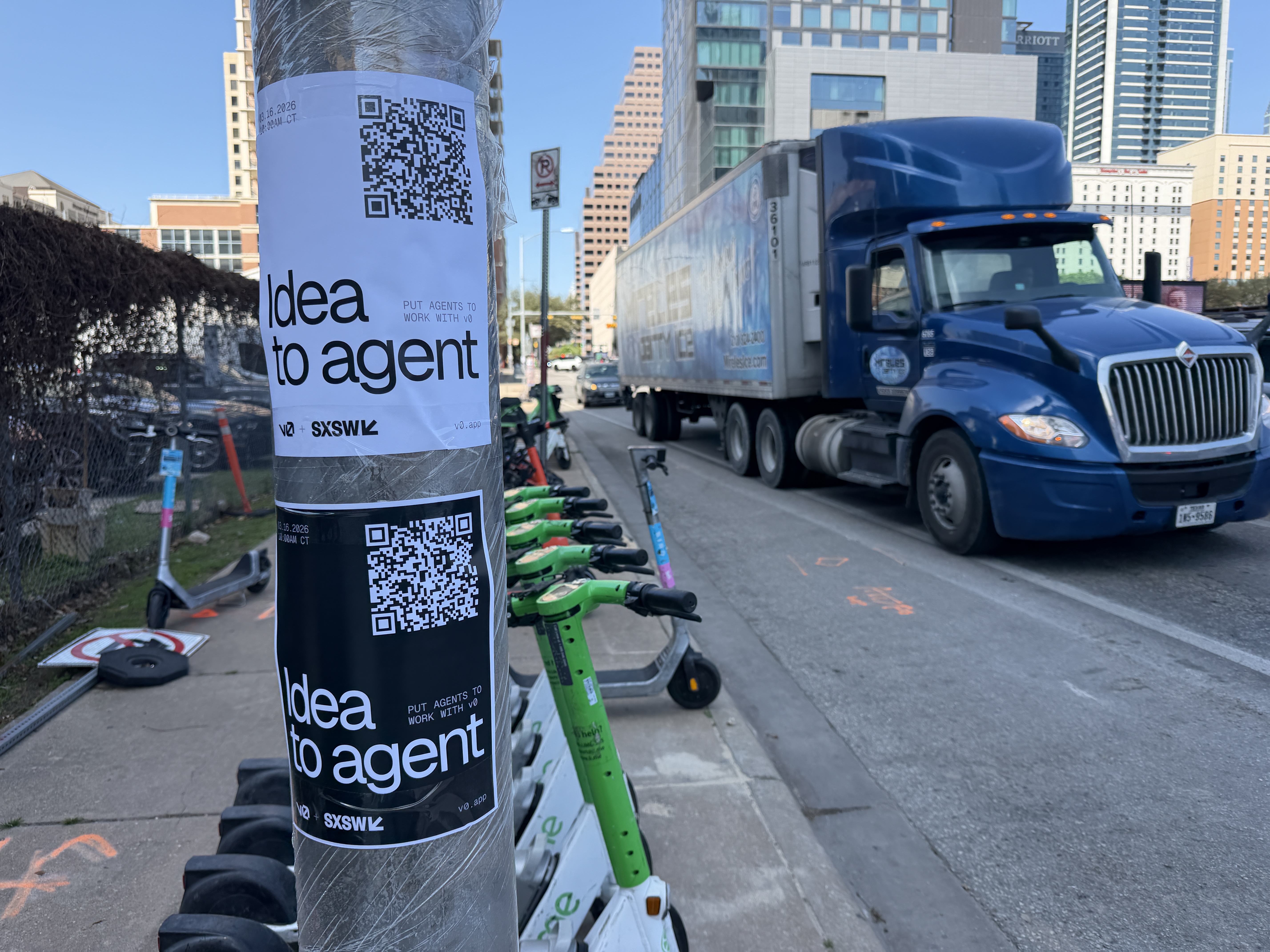 V0 sticker guerilla advertising campaign on a street pole in Austin during SXSW