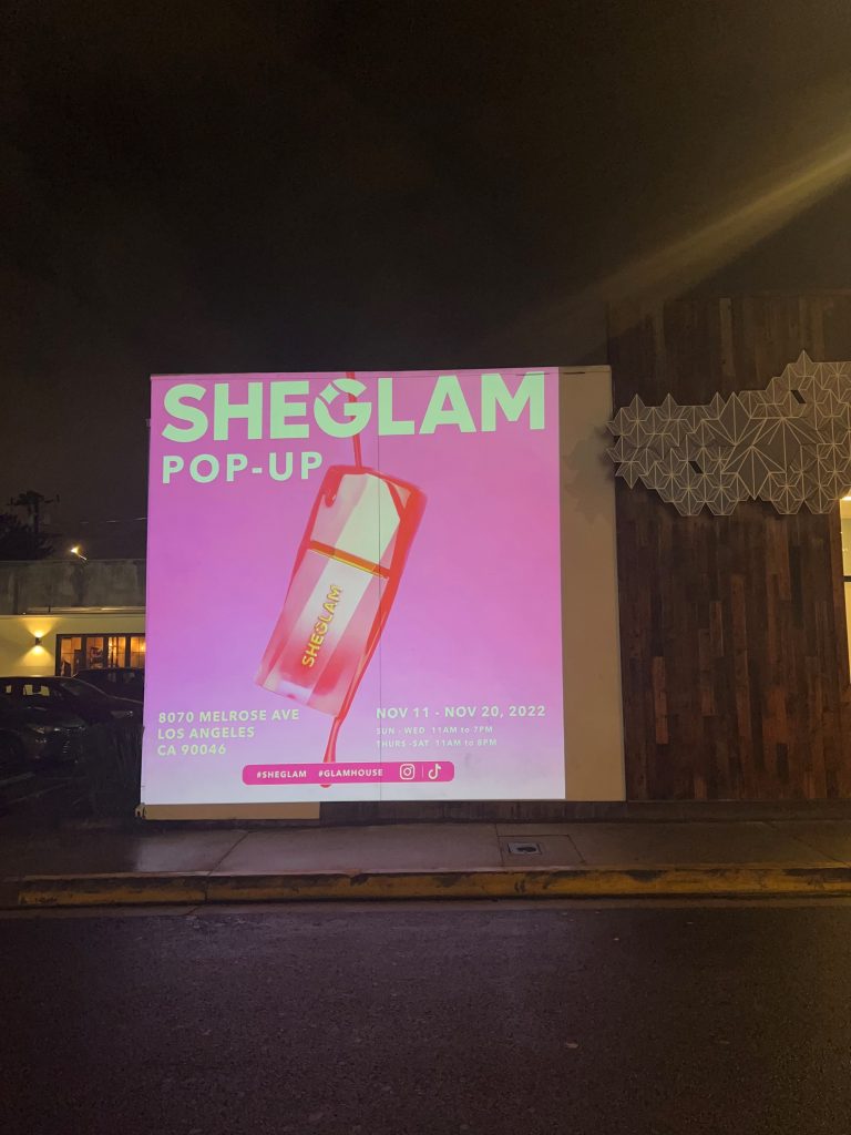 SheGlam pop-up wall projection guerilla advertising on Melrose Avenue in Los Angeles