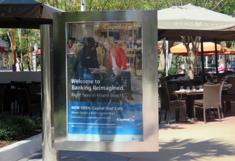 Capital One backlit kiosk display ad at a Miami Beach outdoor shopping center