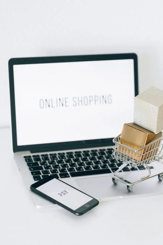 Online shopping cart and laptop representing cart abandonment retargeting campaigns
