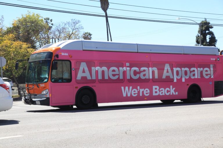 American Apparel "We're Back" bus wrap advertising campaign on a city bus