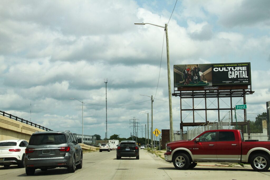 A roadside billboard bulletin seen from the road