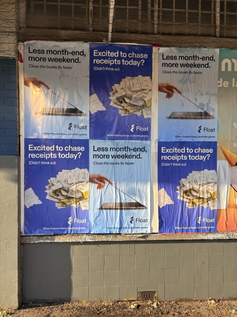 Close-up of Float fintech Wheat Pasting posters in Vancouver showing clean install on a tiled wall