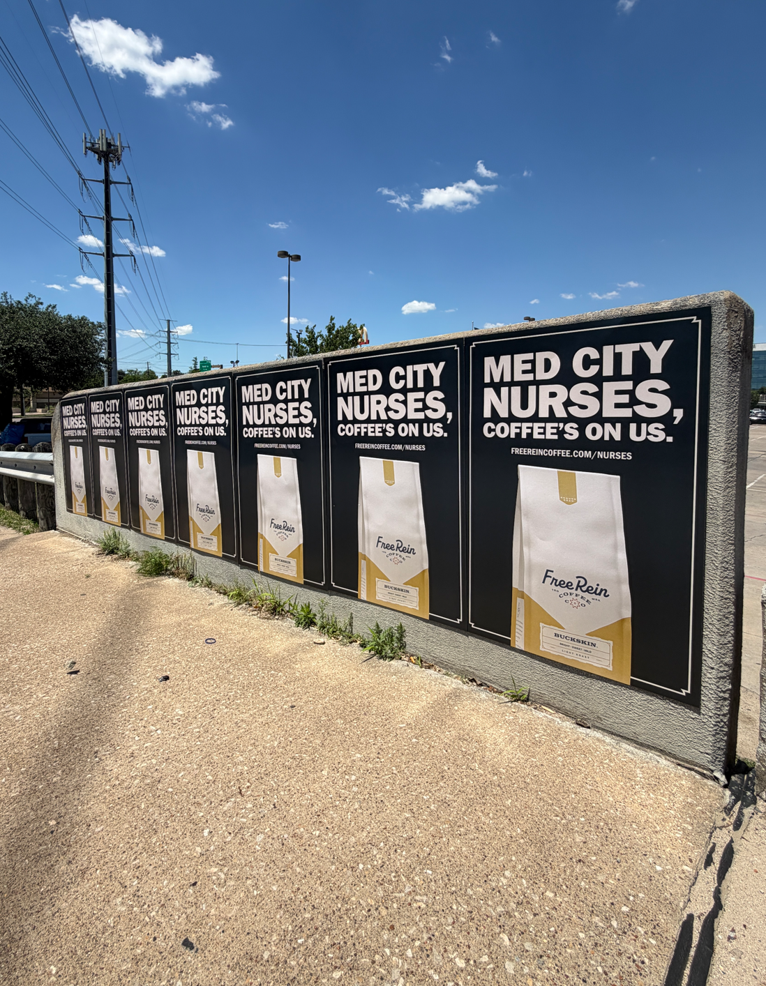 Free Rein Coffee "Med City Nurses, Coffee's On Us" Wild Posting® campaign in Dallas — seven-panel wheat-pasted grid on a concrete retaining wall near Medical City Dallas, installed by DASH TWO.