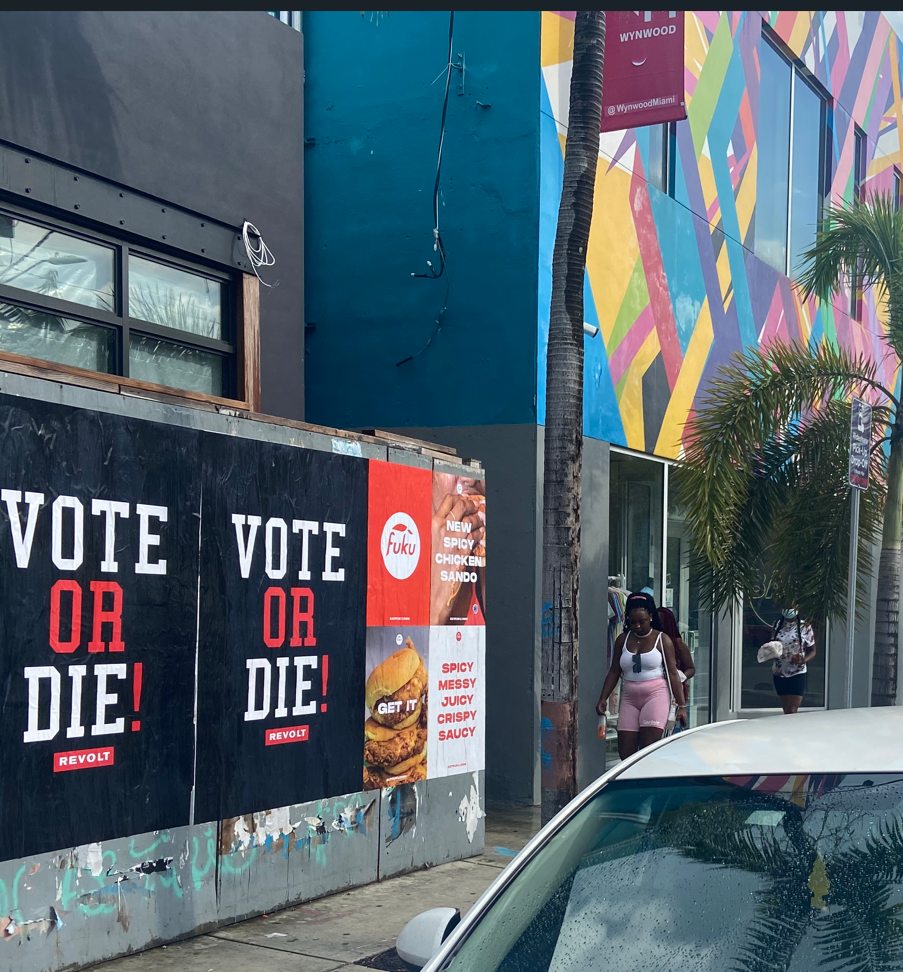REVOLT "Vote or Die!" and Fuku "Spicy Chicken Sando" Wild Posting® campaign on a Wynwood BID corridor, Miami