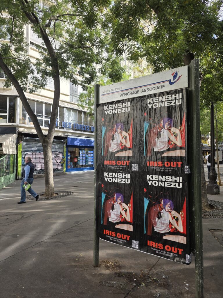 Wild Posting Paris — Kenshi Yonezu "IRIS OUT" Chainsaw Man wheat pasting on a Paris affichage board | DASH TWO