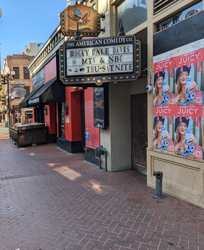 Wild Posting® and wheat pasting campaign for Juicy Sparkle at 5th Avenue and Broadway in San Diego's Gaslamp Quarter, installed by DASH TWO