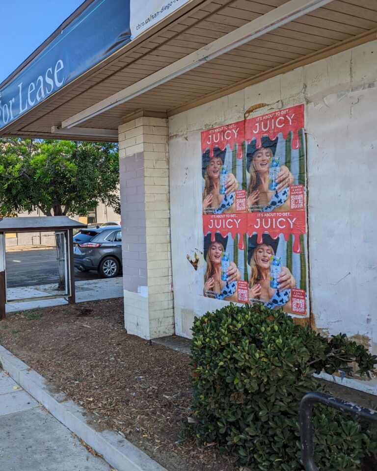 Wild Posting® and wheat pasting campaign for Juicy Sparkle at University Avenue and Iowa Street in San Diego's North Park, installed by DASH TWO