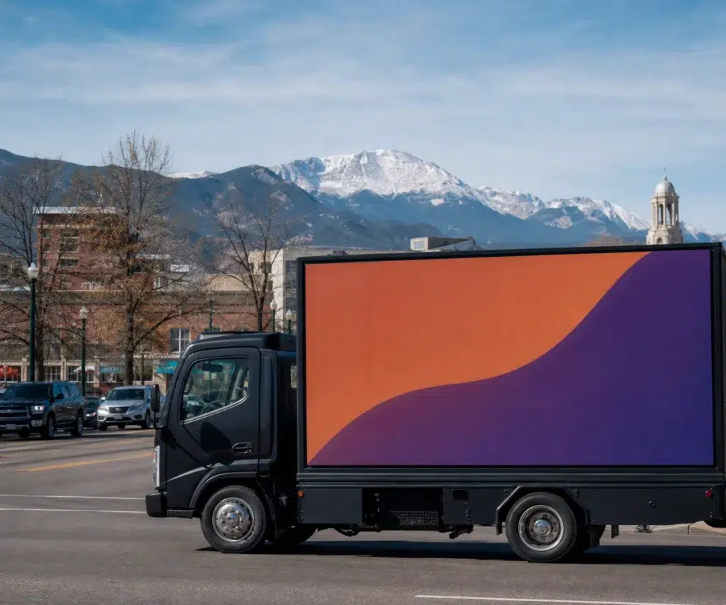 Mobile billboard traveling along US-24 in Colorado Springs, CO