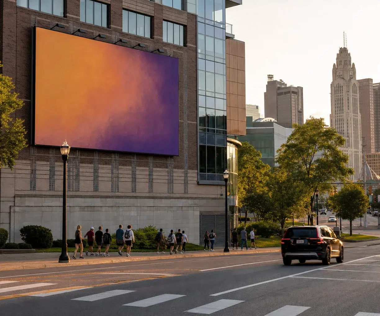 Urban street scene with a large orange-to-purple gradient billboard on a brick building, pedestrians walking on the sidewalk, and a black SUV on the road.